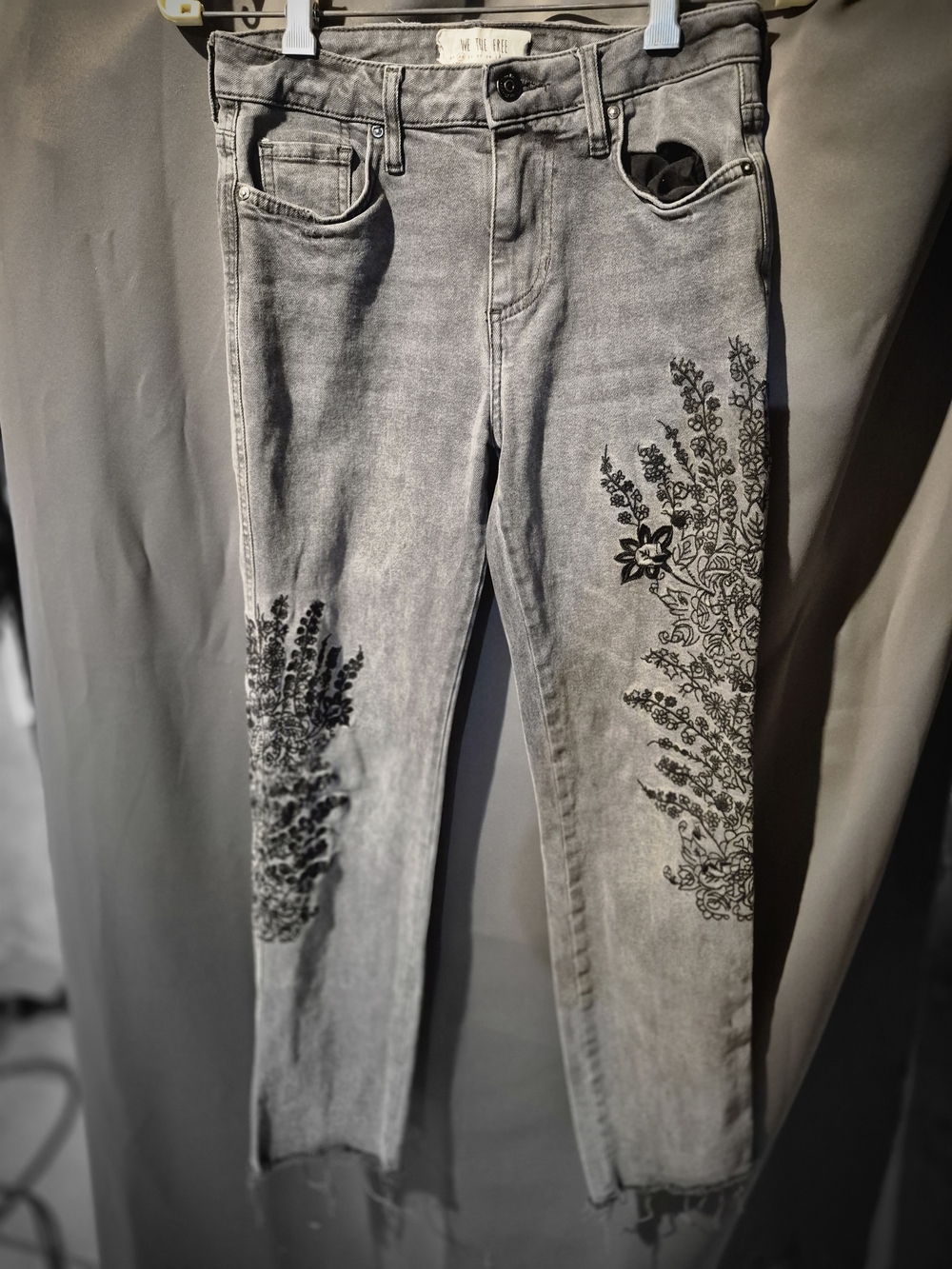 We The Free Gray Skinny Jeans with Black Floral Print